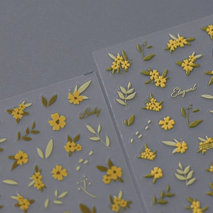 Floral nail art stickers with embossed yellow flowers and green leaves on transparent film