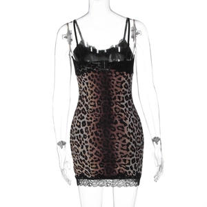 Close-up of black lace trim and leopard print fabric on a sexy mini bodycon dress