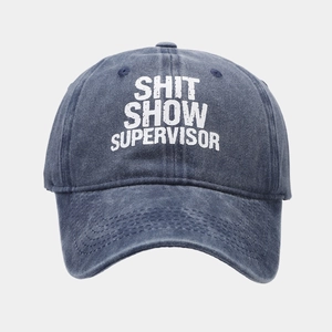 Detail of washed navy cotton baseball cap featuring Shit Show Supervisor print