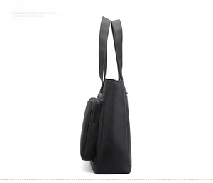 Side view of large black waterproof nylon shoulder bag with adjustable straps and zipper