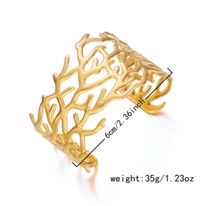 Detail view of golden coral branch cuff bracelet showing 6cm height and 35g weight spec