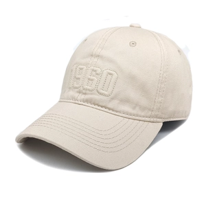 Detailed view of the 1950 3D embroidery on a minimalist beige cotton baseball cap