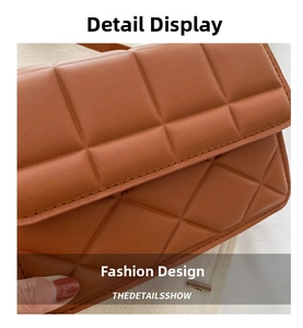 Detail showing the quilted leather texture and stitching of the brown crossbody bag