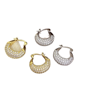 Minimalist gold and silver chunky hoop earrings with cubic zirconia pavé stones