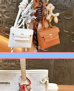 Mini leather bag keychain detail, cute pendant charm with miniature handbag and balloon dog.