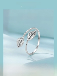 Macro detail of leaf ring showing S925 hallmark on minimalist sterling silver band