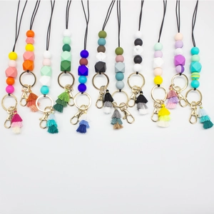 Colorful silicone bead lanyard necklaces with decorative tassels and gold metal clasps