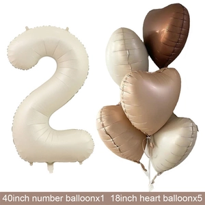 Macro detail of 40-inch cream number 2 and earth tone heart foil balloons set