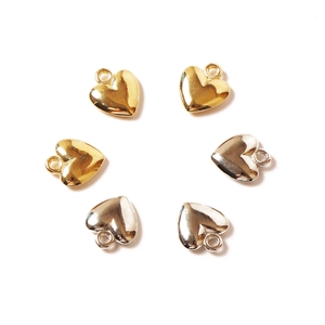Polished heart-shaped metal charms in gold and silver finish for DIY jewelry making