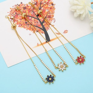 Detailed close-up of adjustable gold-plated daisy bracelets with colorful zircon petals