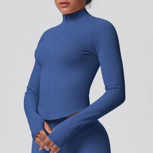Detail of blue zip-up sports jacket with high collar and functional thumbhole cuffs