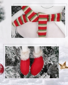 Close-up of plush Christmas stocking with striped scarf, wooden button and red boots