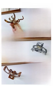 Detail of tortoise shell and marble acetate hair claws with strong metal springs