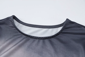 Close-up of the round neckline showing gray gradient print and double stitching details