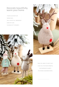 Detail of wool felt Christmas reindeer and elf ornaments with wooden bases for holiday decor