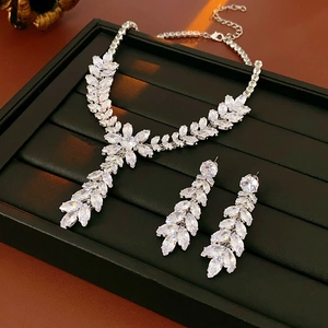 Elegant floral silver-tone necklace and teardrop earrings set with sparkling zircon gems