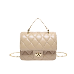 Quilted beige crossbody bag with gold twist lock and chain strap on white background