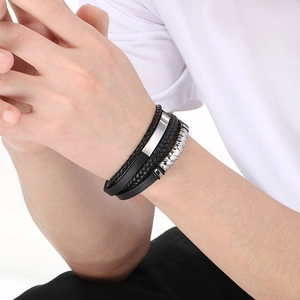 Men's multilayer braided black leather bracelet with stainless steel accents on wrist