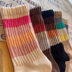 Women's vintage striped ribbed cotton mid-calf socks with colorful retro aesthetics