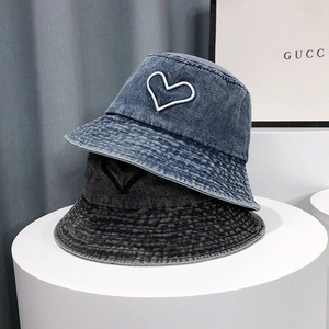 Dual-tone washed denim bucket hats with heart embroidery in light blue and dark grey colors