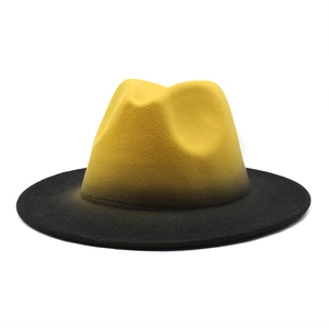 Detailed view of wide brim felt fedora hat featuring yellow and black color gradient