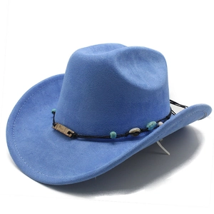 Detail of blue suede cowboy hat featuring ethnic style turquoise bead and bronze ornament