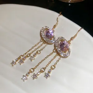 Sparkling star fringe drop earrings with pink zircon stone in a celestial design