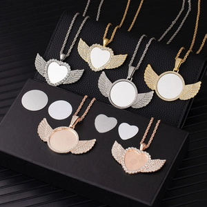 Sublimation angel wing necklaces with rhinestone heart and round blanks on black display