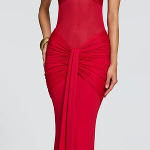 Detailed close-up of ruched fabric and backless design on the red bodycon maxi dress