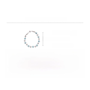 Detail showing 11.6g copper bracelet with blue zircon hexagons and silver flower motifs