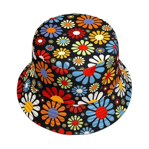 Colorful floral daisy print bucket hat on black canvas with vibrant flower patterns