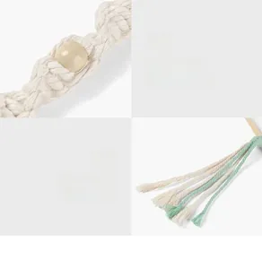 Detail of hand-woven cotton rope with wooden beads and tassels for wall-mounted towel rack