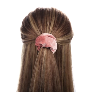 Pink velvet tie-dye hair scrunchie shown in high-quality texture on long hair