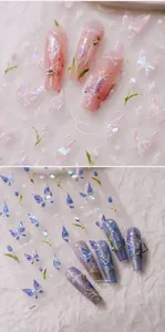 Close-up of butterfly and tulip nail stickers with aurora laser effect on long nails