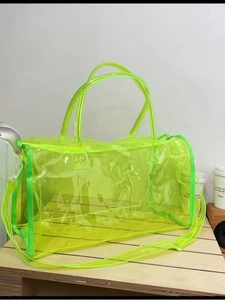 Neon green transparent PVC tote bag with large capacity and matching shoulder strap