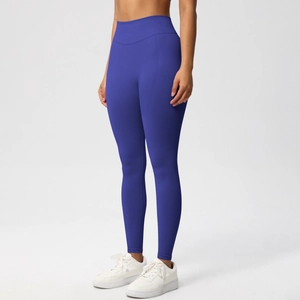Detail view of high-waist seamless yoga pants with peach butt lift design in royal blue