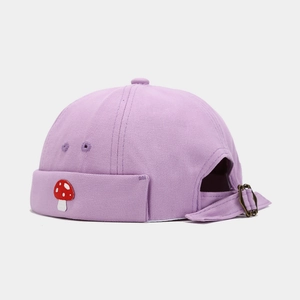 Detail of light purple docker hat with mushroom embroidery and adjustable metal buckle