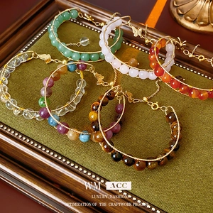Handmade tiger eye and natural crystal beaded bracelets with gold wire and lobster clasp