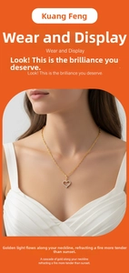 Close-up of a gold heart pendant necklace with shimmering zircon stones on paperclip chain