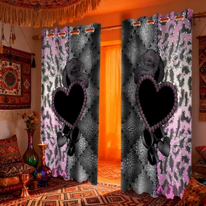 Detail of velvet blackout curtain with pink leopard print and LOVE lettering in a bedroom