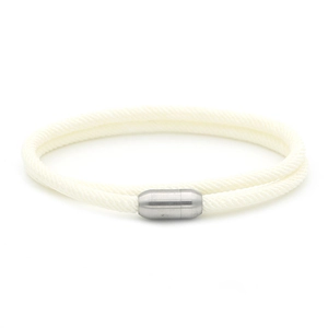Close-up of cream white woven rope necklace with a brushed silver magnetic buckle