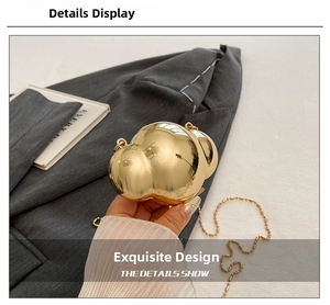 Detailed close-up of golden metallic shell-shaped mini clutch with elegant chain strap