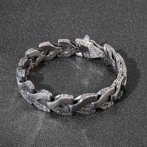 Macro view of men's titanium steel dragon bone bracelet with vintage textured links