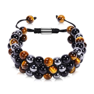 Multi-layer braided bracelet with tiger eye beads and magnetic clasp on white background