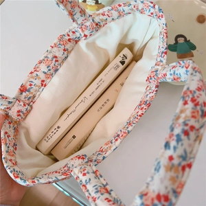 Top view of floral cotton handbag showing interior capacity and soft fabric texture