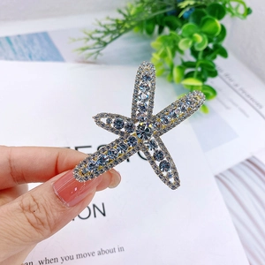 Sparkling rhinestone starfish hair clip in gold finish for elegant hair styling