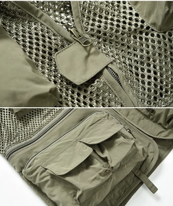 Vue détaillée du gilet de pêche tactique avec maille respirante et poches zippées YKK