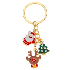 Detail of gold keychain with sparkling rhinestone Christmas tree, Santa and reindeer charms