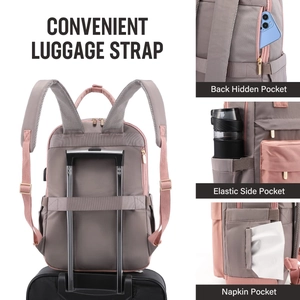 Detail view of pink backpack features including luggage strap and theft-proof pocket