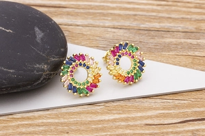Detail view of sunflower earrings with 18k gold plating and colorful zircon crystals